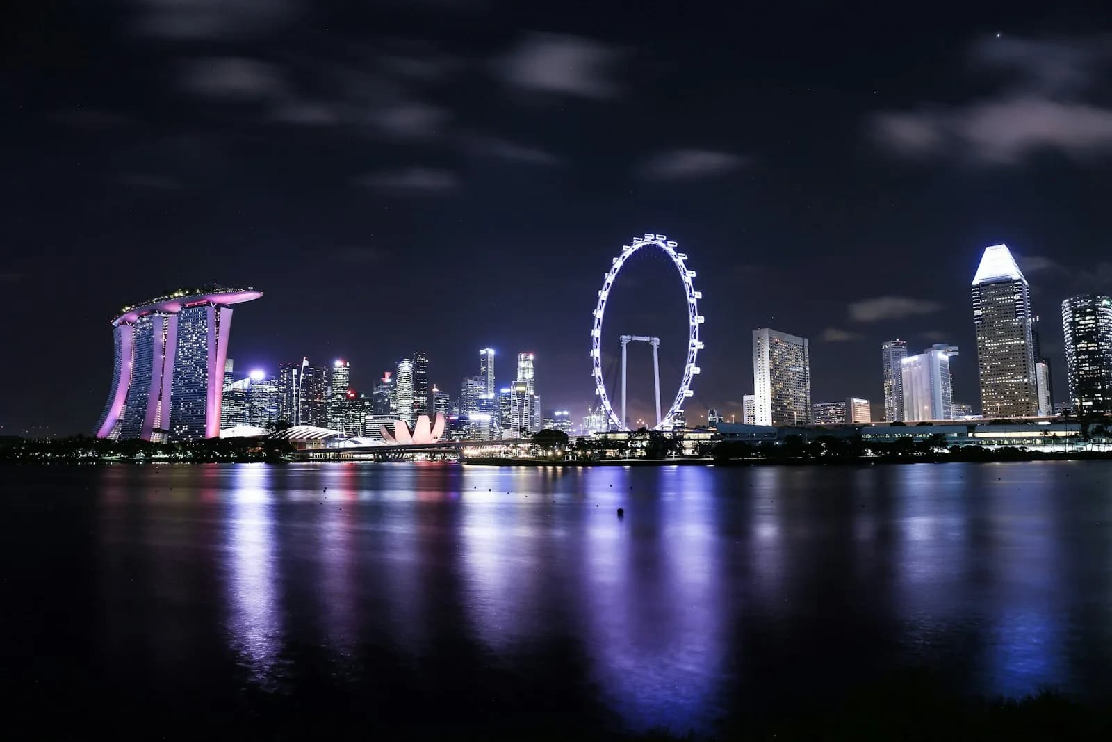 An aerial view of the Singapore city skyline at dusk